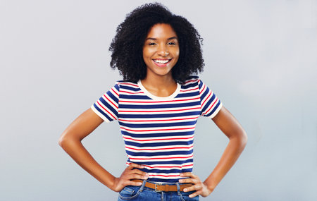 Get moe out of life with a positive mindset. Studio shot of a confident young woman posing against a grey background.の写真素材