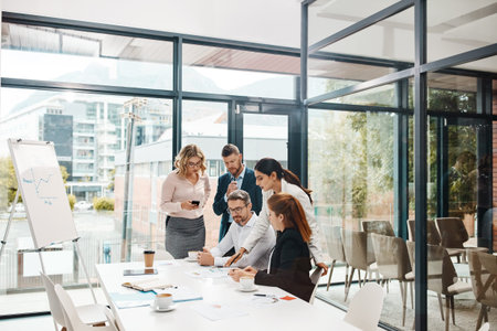 Getting started on their next big success. a group of businesspeople having a meeting in an office.