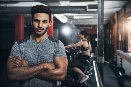I never miss a workout. Portrait of a handsome young man at the gym for a workout.の写真素材