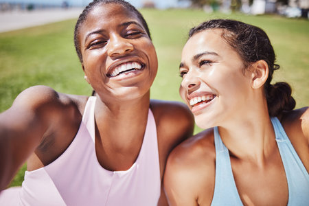 Woman, fitness friends and smile for selfie in sports exercise, workout and training together in nature. Happy active women smiling for photo in healthy happiness and friendship in South Africaの写真素材