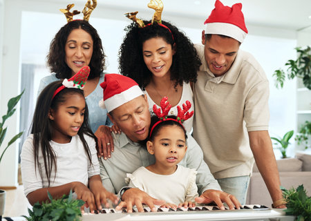 Black family, christmas singing and together at piano for learning, festive celebration or bonding. Father, teaching and girl at keyboard for development, education or holiday for music, mom and kidsの写真素材
