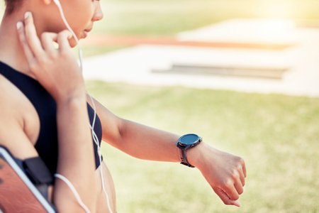 Smartwatch, pulse and woman runner training for a race, competition or marathon on a field. Fitness,...