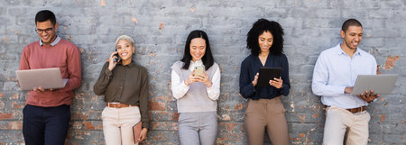 Recruitment, success and people in waiting room on job search, internship opportunity or career diversity. Brick wall, technology and group friends on website, laptop and phone call for we are hiringの写真素材