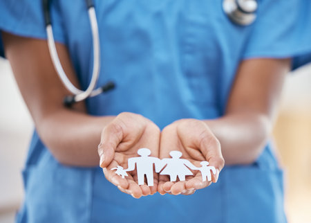 Family nurse, doctor and woman hands with paper dolls to show children healthcare insurance. Hospital, medical and kids cardiology worker with helping hand support gesture cutout for clinic careの写真素材