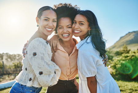 Portrait, travel or friends in nature with a happy smile on fun girls trip on summer holidays vacation together. Support, relaxing or young women hugging or enjoying bonding in countryside on weekendの写真素材