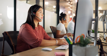 Call center, woman and phone call, contact us with CRM, customer service or telemarketing sales, conversation and technology. Communication, headset and female call centre employee, help and computerの写真素材