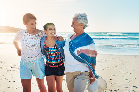 We left the boys at home. a senior woman spending the day at the beach with her daughter and granddaughter.の写真素材