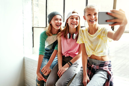 The dancers selfie. young girls taking a selfie in a dancing studio.の写真素材