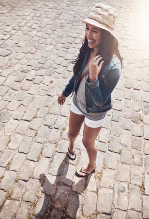 I love life out in the concrete jungle. a beautiful young woman spending her day in the city.の写真素材