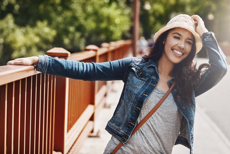 I love hot days. a playful young woman spending the day outdoors.の写真素材