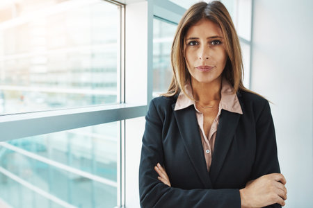 Determined to do my best in business. Portrait of a confident businesswoman standing in a modern...