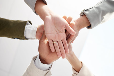 Business people, hands together and solidarity with team support, low angle and motivation in...