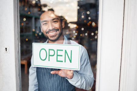 Asian man, small business and portrait with open sign on window for service in coffee shop or...