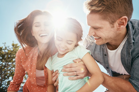 Enjoying a day outdoors. a family bonding together outdoors.の写真素材