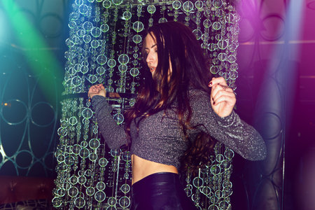 Immerse yourself in the music and let go. a young woman enjoying herself on the dance floor of a...