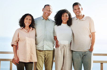 Portrait, smile and big family by beach on vacation, holiday or trip outdoors. Travel, care and...