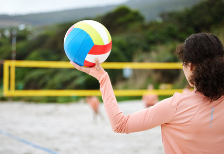 Volleyball, beach body or hand of girl playing a game in training or team workout in summer together. Sports fitness, zoom or healthy woman on sand ready to start a fun competitive match in Brazilの写真素材
