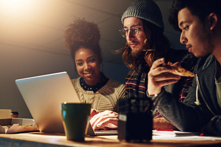 University teamwork, laptop and students working on web search for IT college, digital database research or project. Education learning, night school study or collaboration review of online analyticsの写真素材