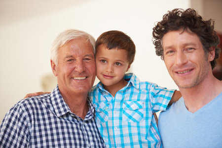 The guys are hanging out together today. Portrait of a little boy with his father and grandfather.の写真素材