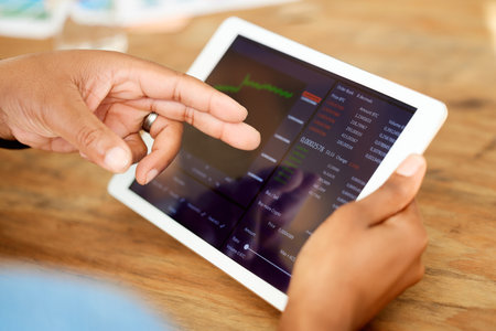 Stock market, investment and tablet with hands of person for chart, trading and forex research. Finance, data analysis and cryptocurrency with employee and graph for growth, technology and appの写真素材