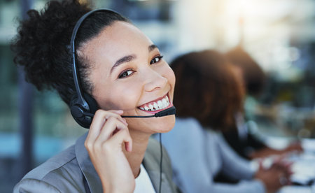 Portrait of a young woman working in a call centre.の写真素材