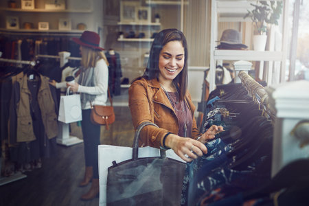 a young woman shopping at a clothing store.