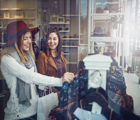 two best friends out shopping in a clothing store.の写真素材