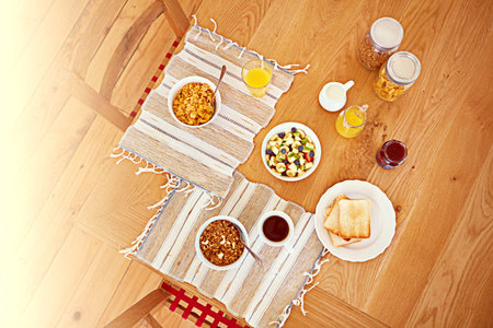 Looks good enough to eat. High angle shot of an empty table set with breakfast foods.