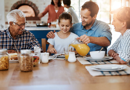 Breakfast is an important bonding time for them. a multi generational family enjoying breakfast...