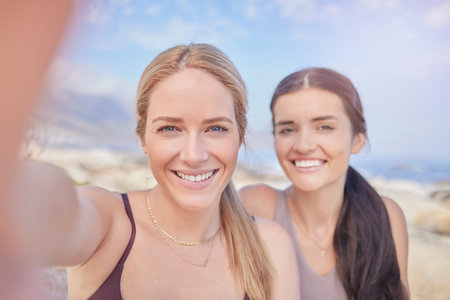 Selfie, fitness and portrait of women in nature for fitness, training and bonding after a workout. Happy, together and friends taking a photo for cardio memory, quality time and hiking in Norwayの写真素材