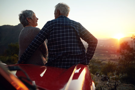 One of lifes greatest joys is to travel. a senior couple enjoying a road trip.の写真素材