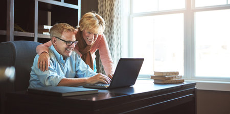 We have more than enough money for retirement. a mature woman keeping her husband company while he...