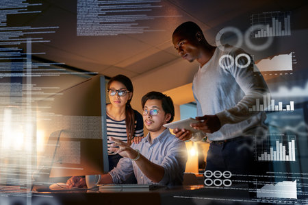 Cracking codes no matter the time. Shot of computer programmers looking through data in the office.の写真素材