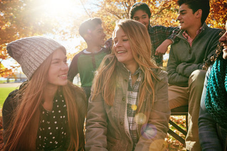So much happiness was shared that day. a group of young friends enjoying a day at the park together.の写真素材