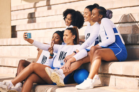 Sports, team or netball friends selfie for fitness, workout or training achievement memory for social media. Exercise, girl sport and happy women for diversity photograph or online students blogの写真素材