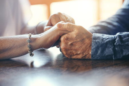 Support, hope and old couple love holding hands together to show empathy, gratitude and solidarity in marriage. Trust, old man and elderly woman care, respect and help each other in retirement lifeの写真素材