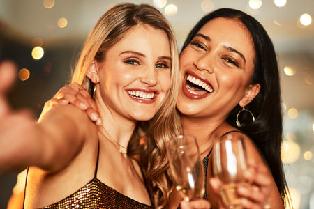 Party, champagne and women friends selfie at nightclub to celebrate birthday, new years or happy hour together with a hug, happiness and fun. Portrait for ladies night celebration with alcohol drinksの写真素材