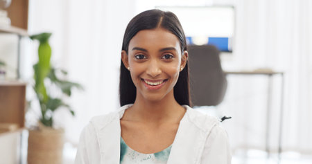 Happy woman, smile and portrait of Indian girl feeling content and showing a positive attitude at...