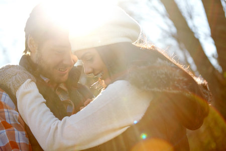 Treasuring each other...A loving young couple being affectionate while standing together in the...