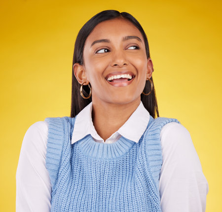 Ideas, thinking and woman with a smile, success and fantasy against a studio background. Indian...