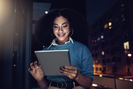 Happy, tablet and night with woman in city for technology, corporate and communication. Social media, connection and internet with business female and search online for networking, email and websiteの写真素材