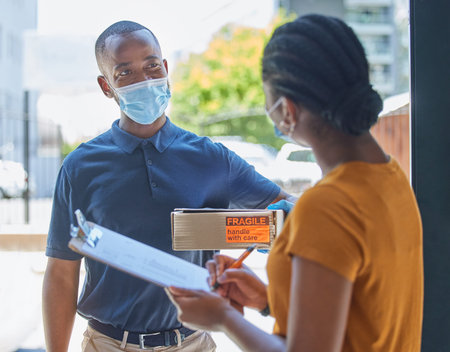 Covid, delivery and man with a box for a black woman in face mask for coronavirus compliance after...