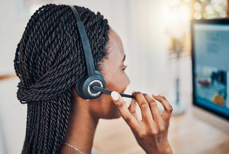Call center agent, black woman working in customer support in Chicago and business receptionist...
