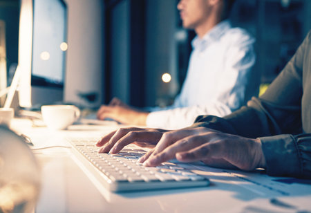 Online, computer and night with hands of person in office for email, overtime and project proposal....
