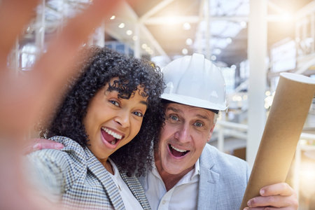 Selfie, engineer and employees excited, success and new project with smile, celebration and work target. Portrait, male architect and black woman with happiness, corporate deal and goals for companyの写真素材