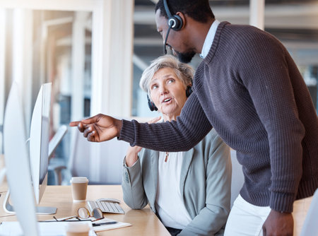 Call center, black man and coach training employee in customer service or support in office....