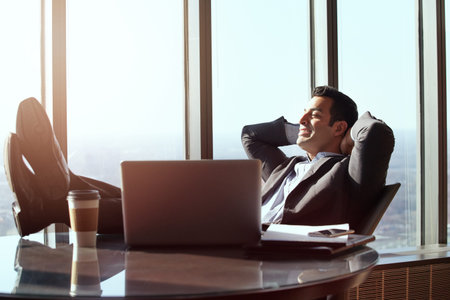 Feeling relaxed. a handsome young businessman looking relaxed while sitting in his office.