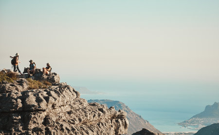 Nature is our home away from home. a group of friends hiking up a mountain.の写真素材