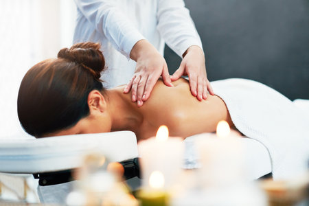 Youll feel so rejuvenated after one of our treatments. a young woman enjoying a beauty treatment at a spa.の写真素材