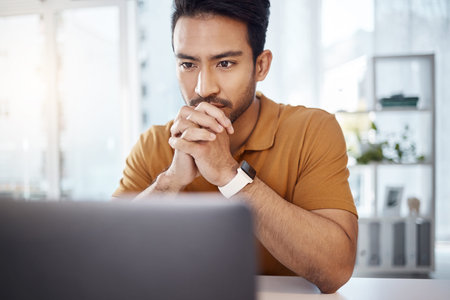 Laptop, business and Asian man with focus, thinking and ideas for new project, creativity or online...